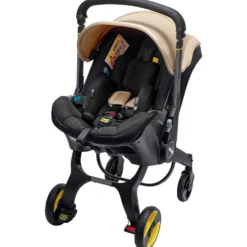 Doona I Babyskydd Och Barnvagn I Ett Sahara Sand